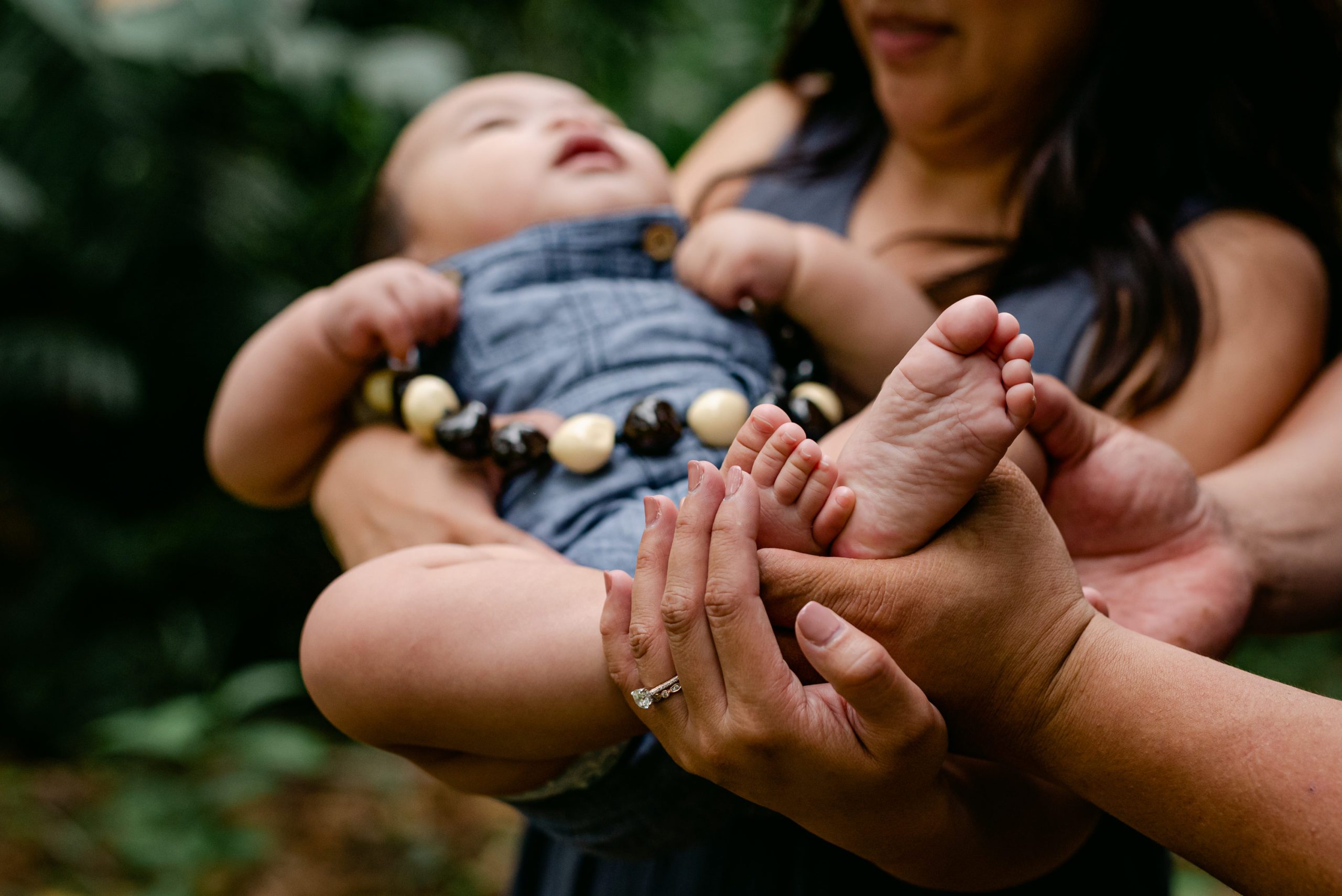 holding baby's feet