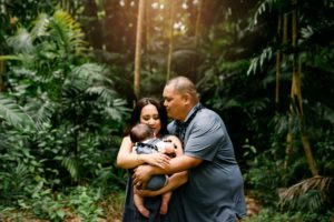 Family in Hawaiian rain forest