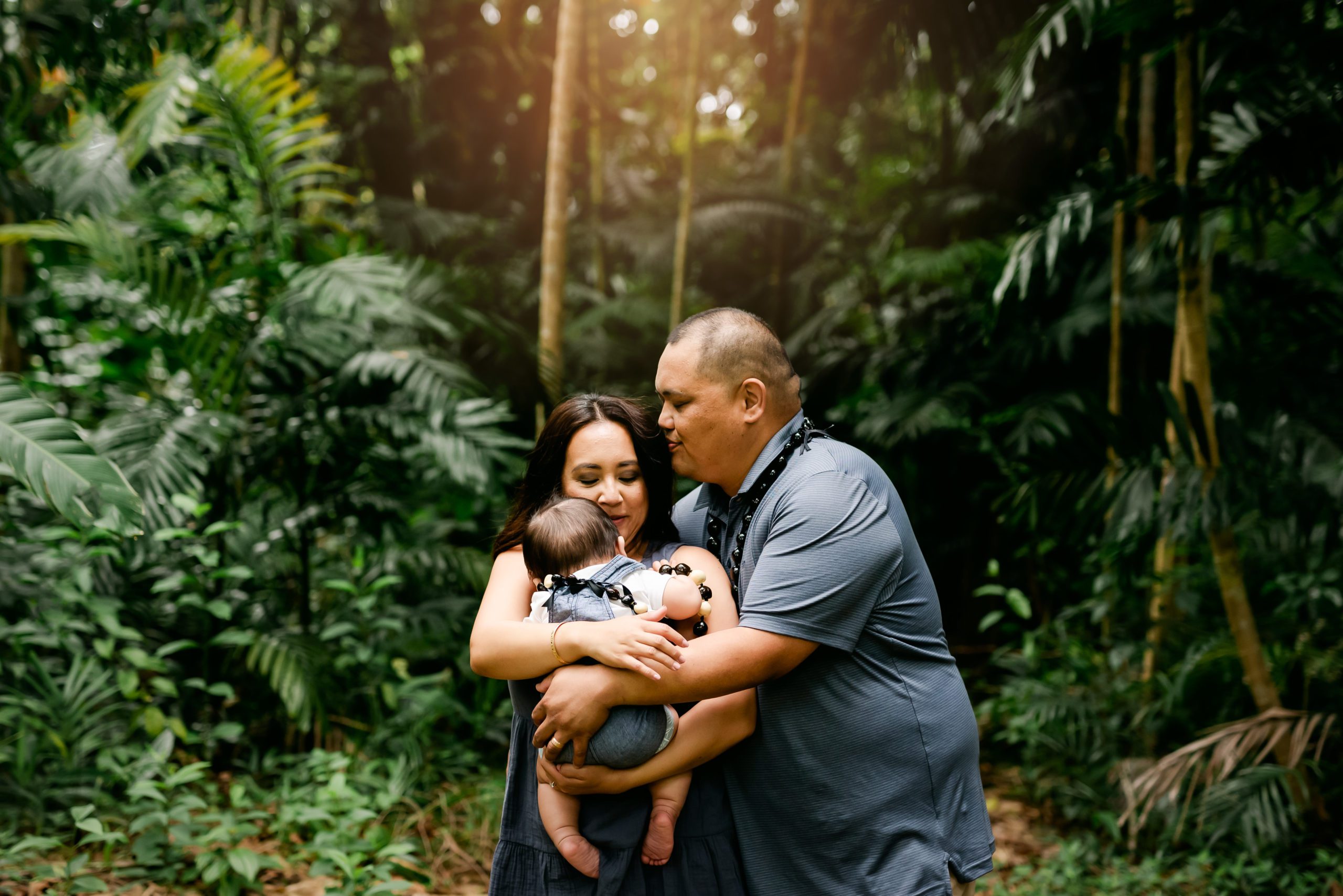 Family in Hawaiian rain forest