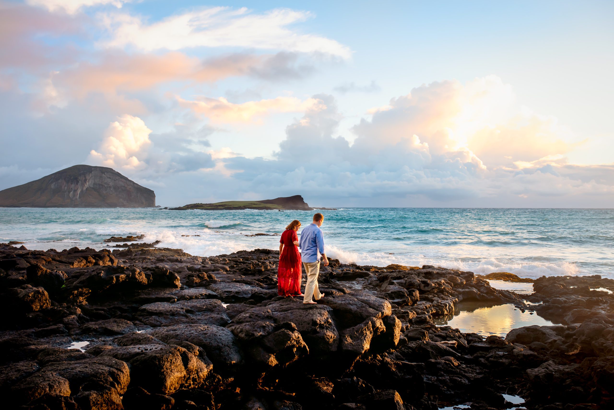 Couple walking on lava rocks